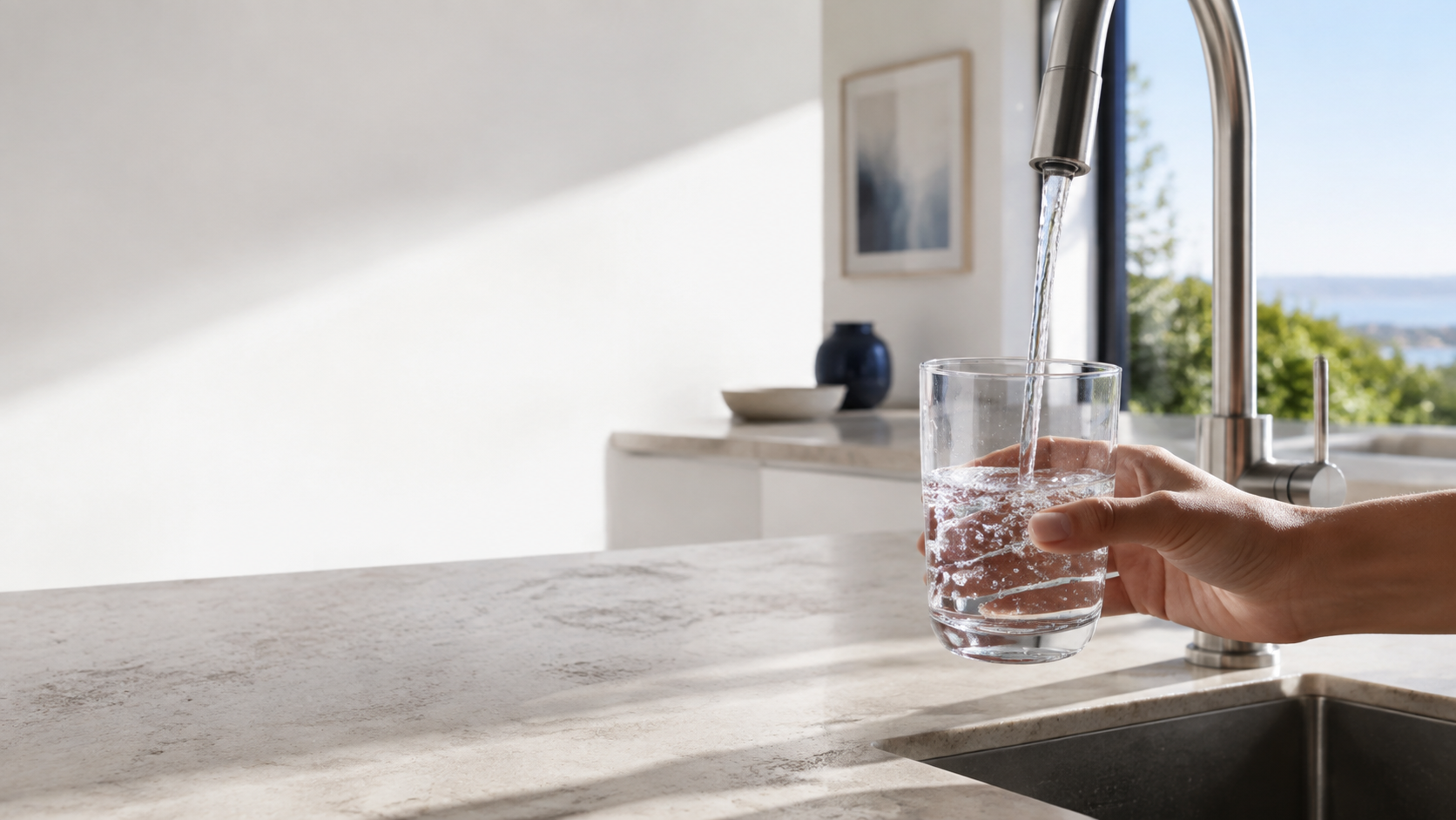 A glass filling with water at a household tap